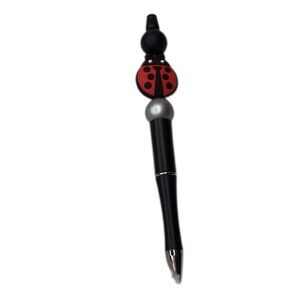 Handcrafted beaded pen. Black/red/silver/lady bug. Made with bpa free silicon…